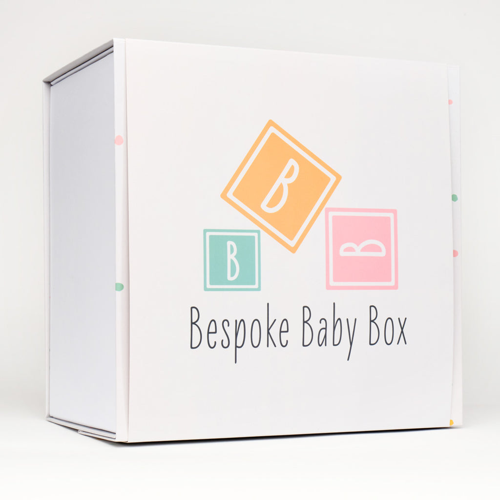 Baby keepsake memory box in neutral dotty pattern design with sleeve featuring the Bespoke baby box logo