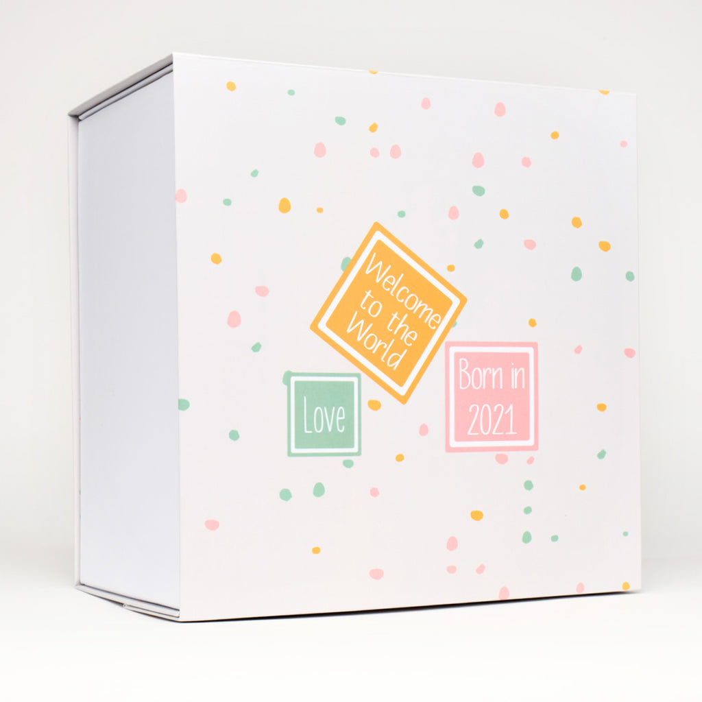 Baby keepsake memory box in neutral dotty pattern design.  that can be personalised, featuring the words, welcome to the world, Love and born in 2021. From Bespoke baby box