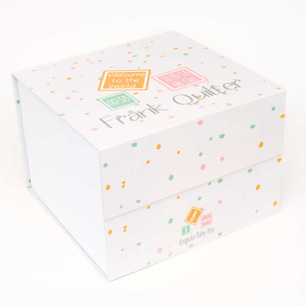Baby keepsake memory box in neutral dotty pattern design.  that can be personalised with new born baby details such as name and date of birth as well as the words "welcome to the world". From Bespoke baby box