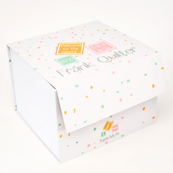 Baby keepsake memory box in neutral dotty pattern design.  that can be personalised with new born baby details such as name and date of birth as well as the words "welcome to the world". From Bespoke baby box