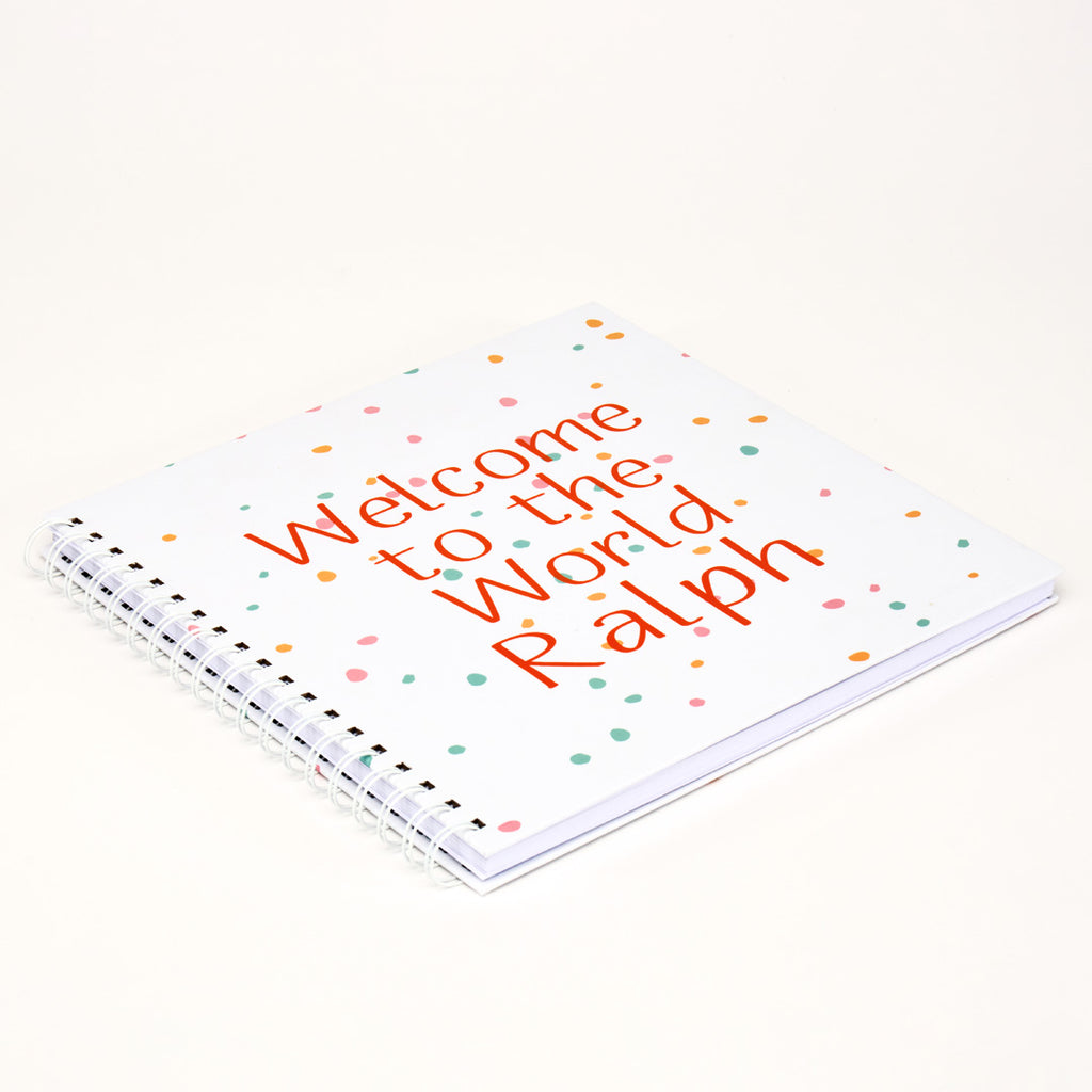Ring-bound Memory Book that can be personalised, for example, Welcome to the World Ralph, in orange text