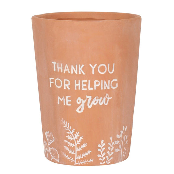 Terracotta Plant Pot with the words, Thank you for helping me grow" written on it