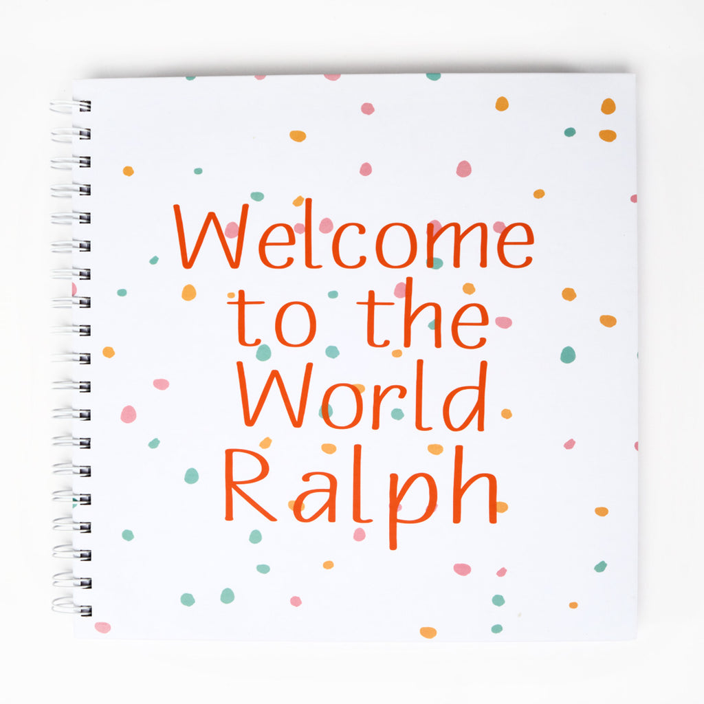 Ring-bound Memory Book that can be personalised, for example, Welcome to the World Ralph, in orange text