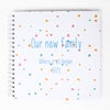 Ring-bound Memory Book that can be personalised, for example, Our new family, where it all began. In blue colour text