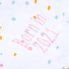 Close up of the words "Born in 2021" embroidered in pink thread on a Personalised baby Blanket in neutral pastel colours