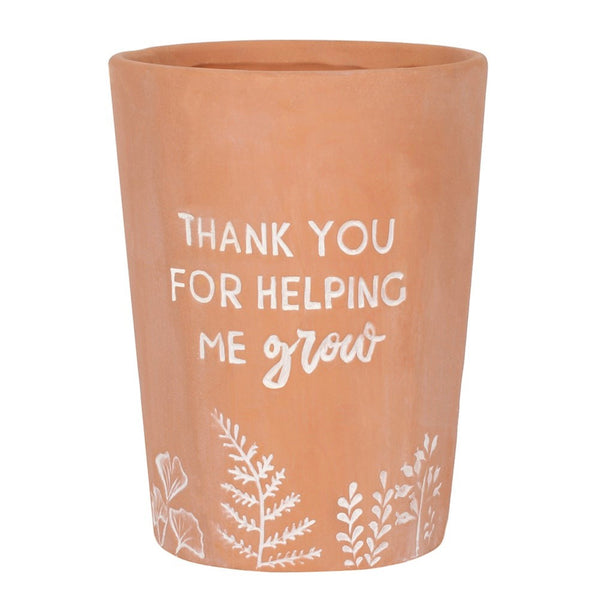 Terracotta Plant Pot with the words, Thank you for helping me grow" written on it 